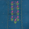 Embroidered fabric with floral patterns on a blue background